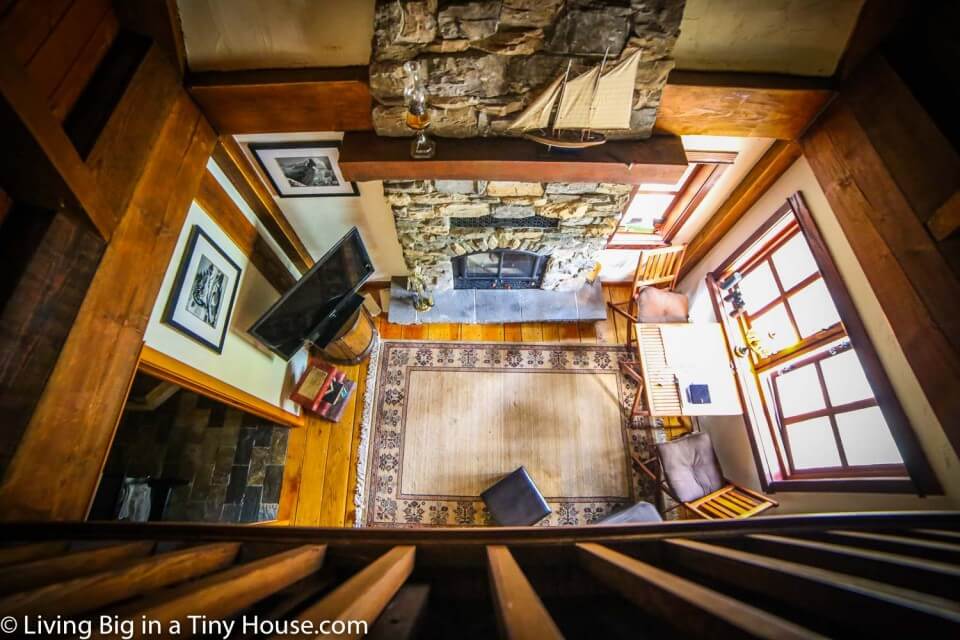 One photo of an aerial view of the living room in the tiny home.
