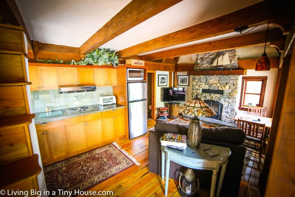 One photo of the living room and kitchen area.