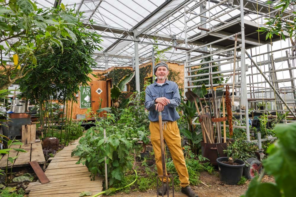 He Built a Tiny House Inside a Massive Greenhouse